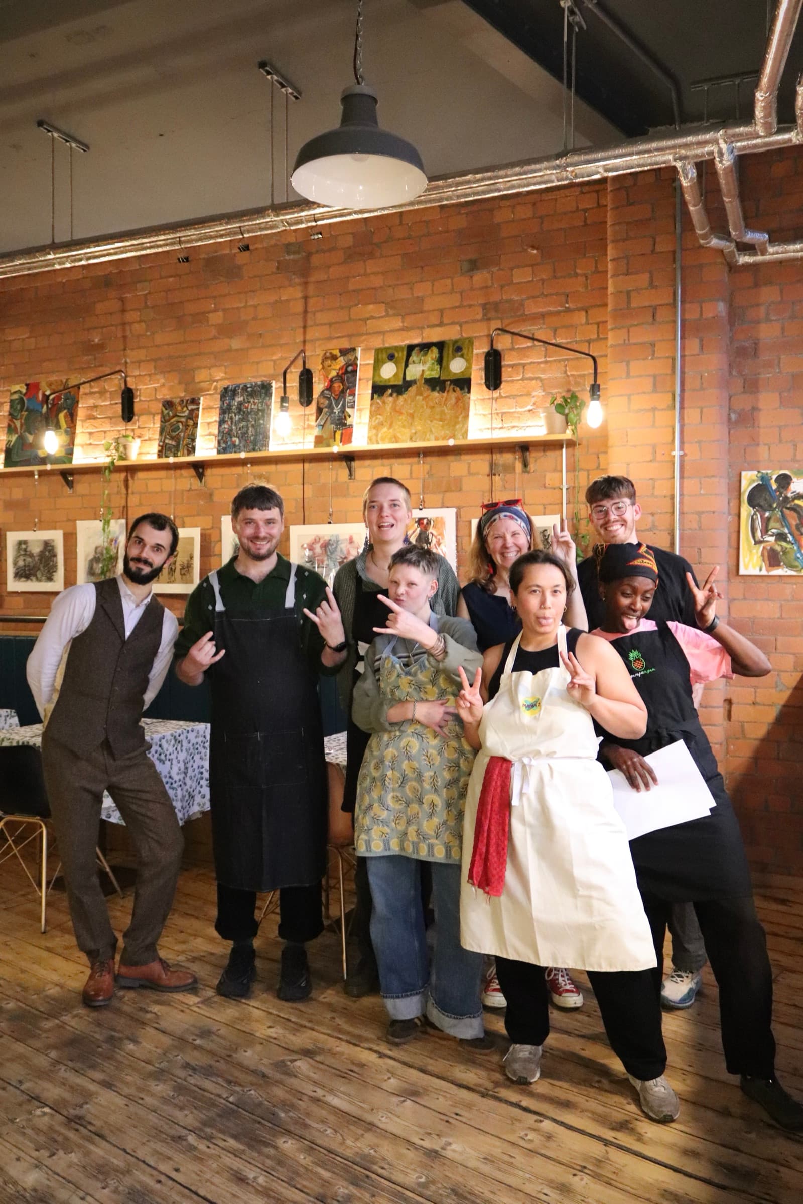The team laughing and posing together after service