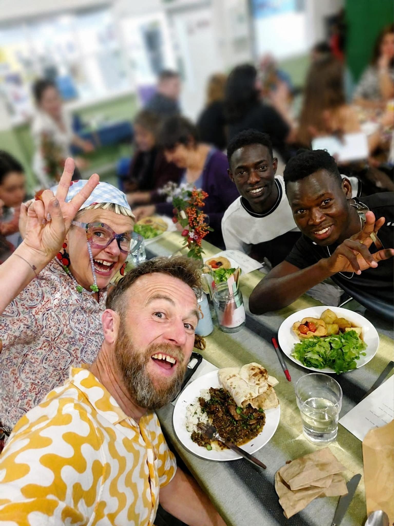 Guests laughing around the table